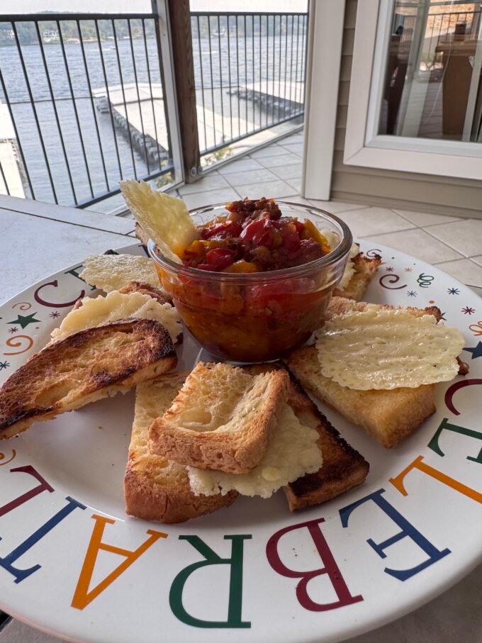 food on a plate with a gate and dock in the background.